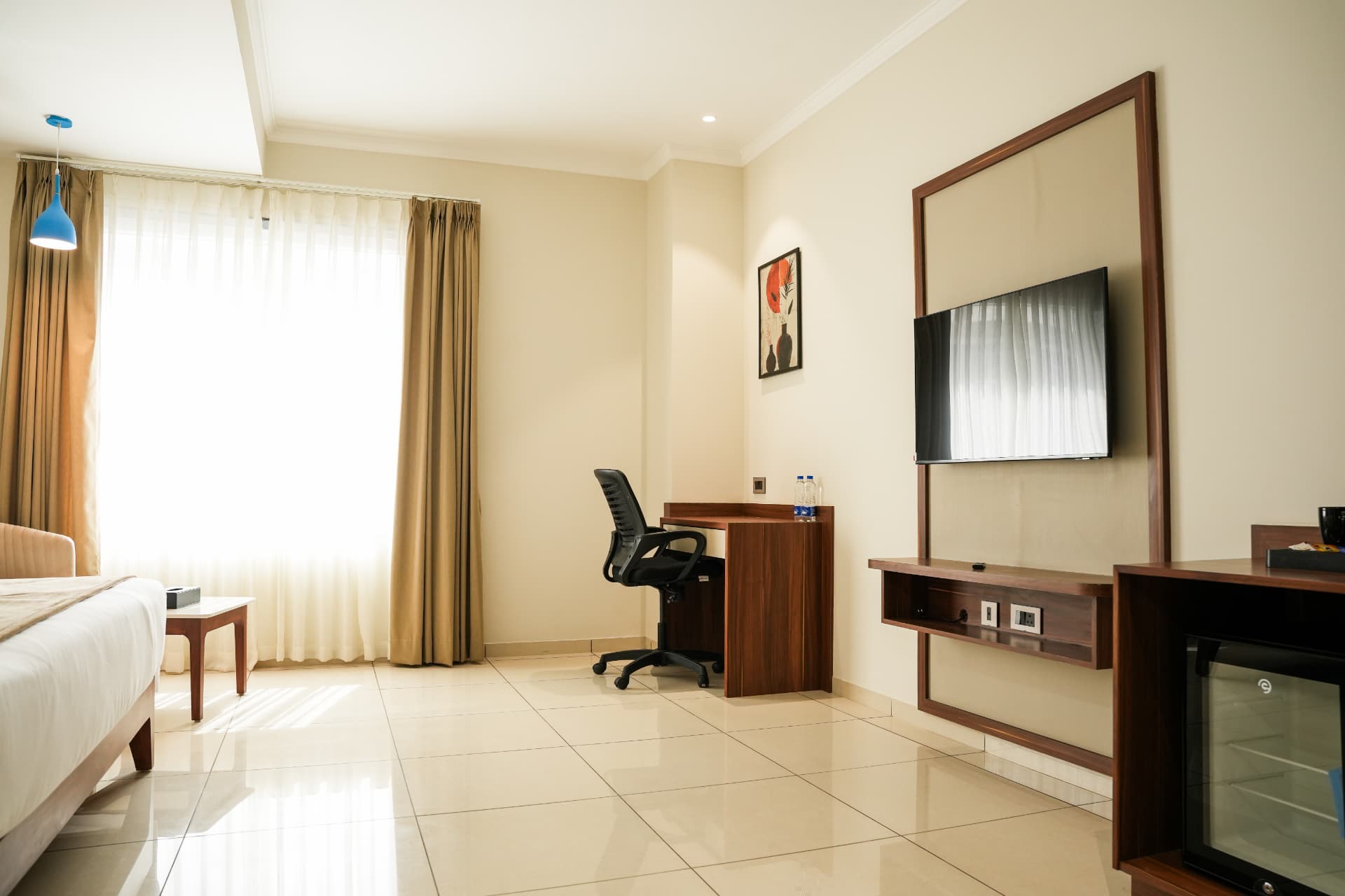 The Club Room seen toward the window, with the desk and wall-mounted screen